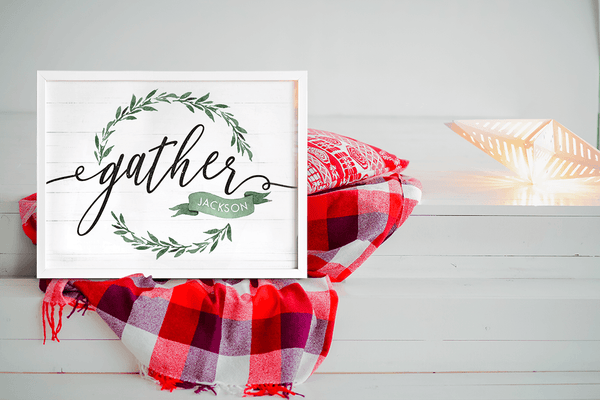 a farmhouse styled home with a holiday blanket and lights and a personalized Gather sign