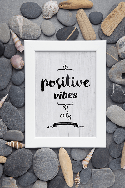 Framed Positive Vibes Only personalized print surrounded by rocks and shells