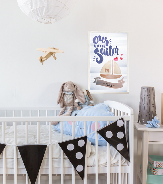 Baby boy's room with Our Little Sailor personalized print.
