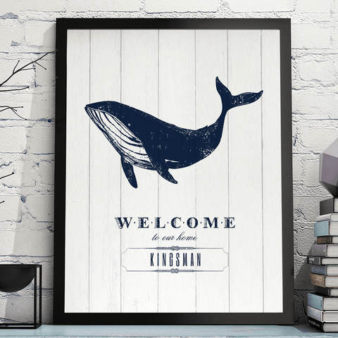 Nautical themed print with text Welcome to our home under a drawing of a blue whale. Personalize it with your family name.