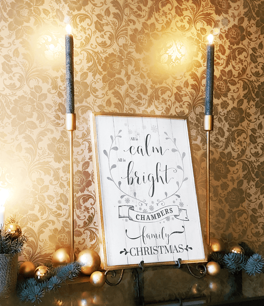 Room decorated in gold for the holidays with a framed All Is Calm personalized print