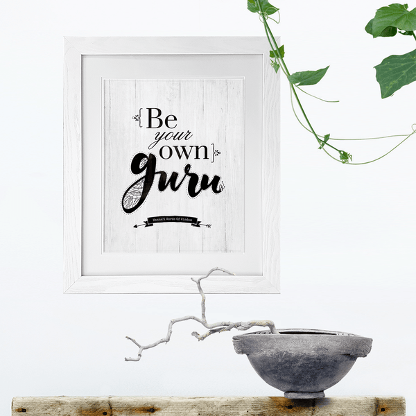 modern room with houseplants and Be Your Own Guru print handing framed on the wall