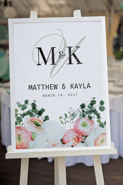 Bouquet personalized print framed on an easel at a wedding reception