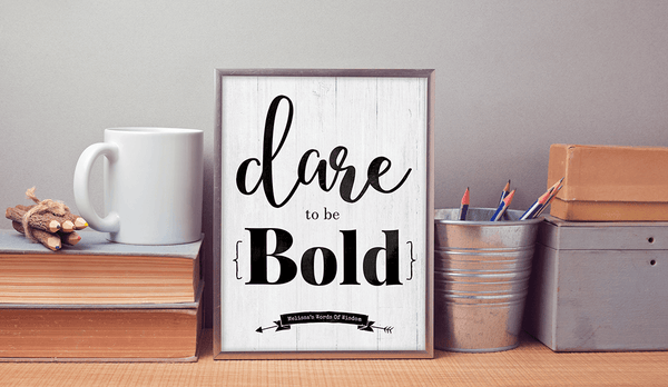 work desk with the personalized and framed Dare To Be Bold print