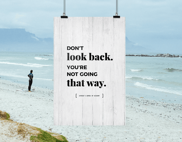 Don't Look Back personalized print hanging against an inspiring beach background