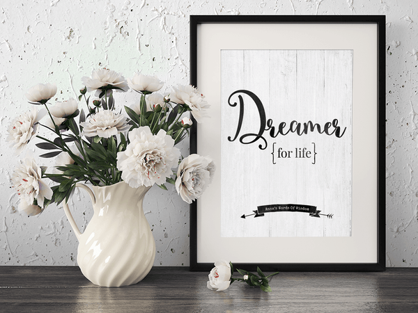 Framed Dreamer For Life personalized print on the desk with flowers.