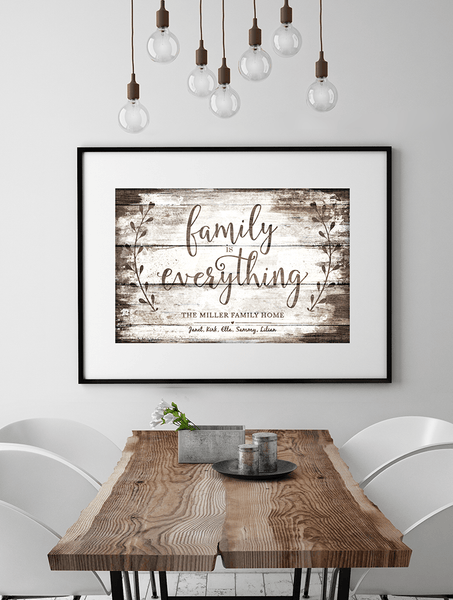 Modern dining room with vintage touches and a framed Family Is Everything - Vintage personalized print on the wall