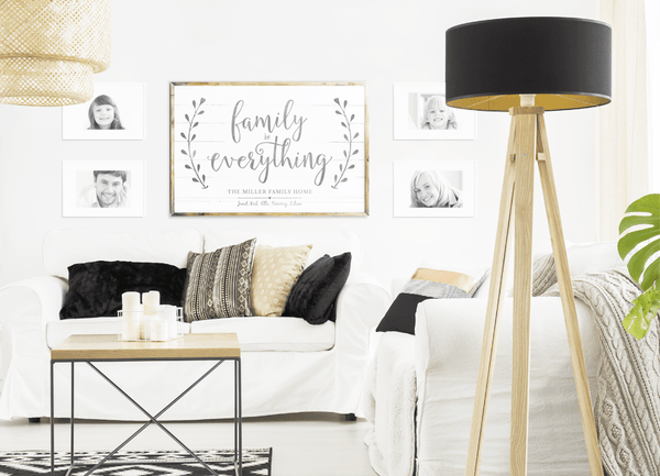 Gallery wall with a Family Is Everything personalized print in a modern living room