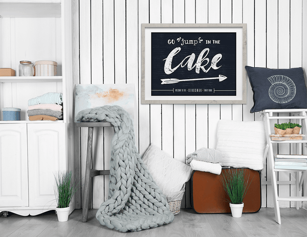 cottage room with Go Jump In The Lake print on the wall