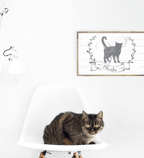Kitty Kat personalized print framed on the wall in a modern room with a cat on a chair