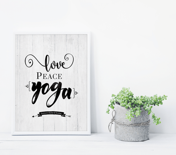 Love Peace Yoga personalized print framed in white on a shelf with succulents