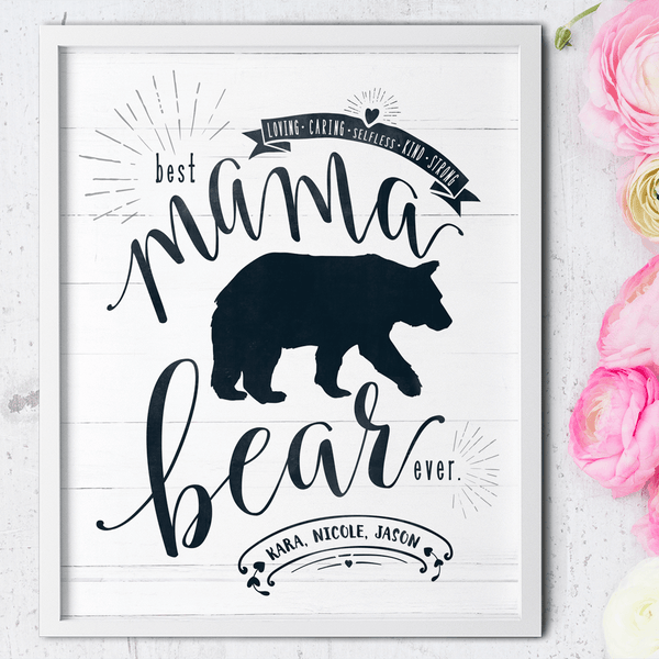 Mama bear print framed on a table full of flowers