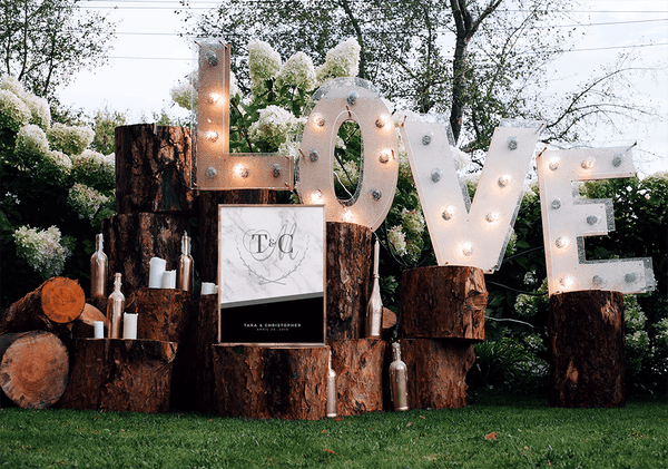 MK Black Wedding Personalized Print at a beautiful outdoor boho wedding with wood logs