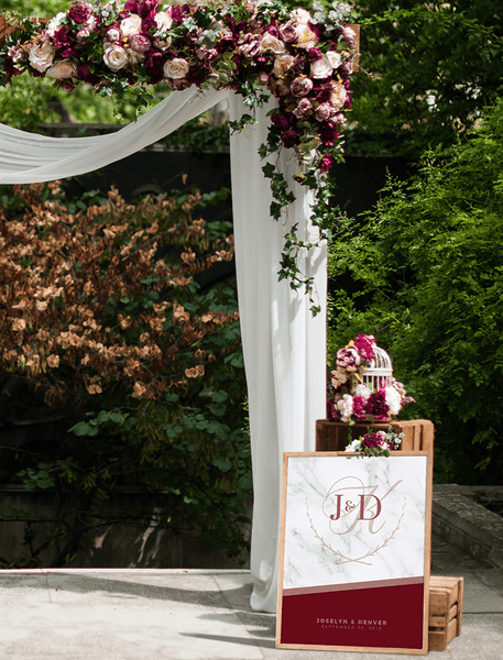 MK Wine Wedding Personalized Print at a rustic wedding altar with dark red burgundy flowers