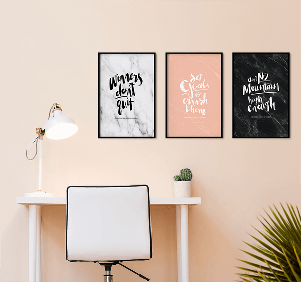 Gallery wall created in a beautiful blush workspace with personalized prints. Winners Don't Quit. Set Goals & Crush Them. Ain't No Mountain High Enough.
