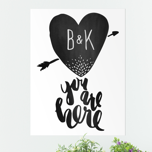 Watercolor textured heart with your own initials. Arrow goes through the heart and text below reads "You are here"