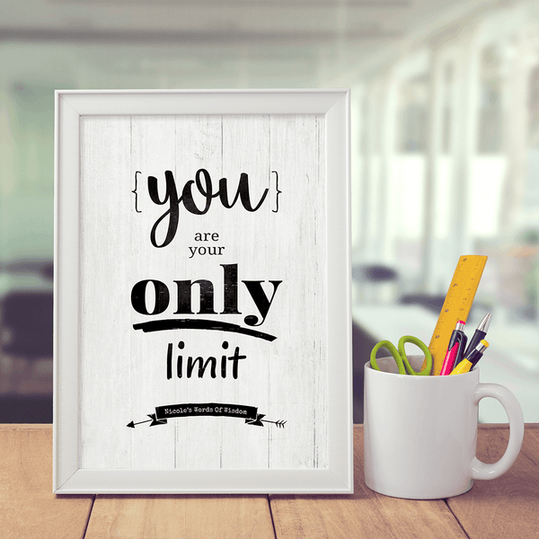 work desk with a personalized Your Are Your Only Limit print
